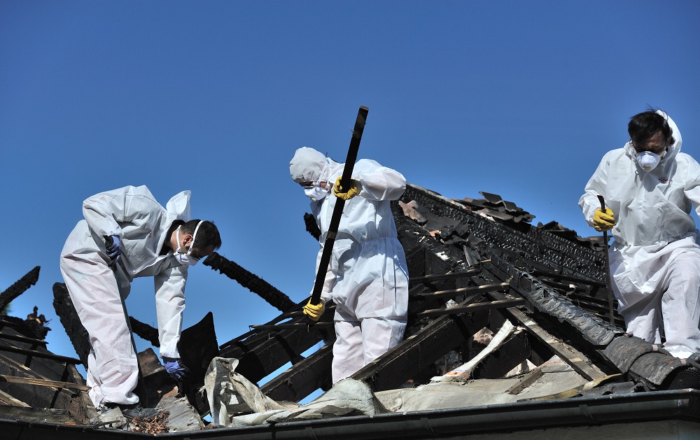 Workers Repairing Fire Damage