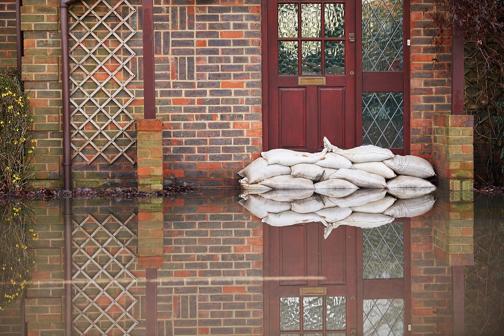 Sandbags Outside Front Door of Red Brick House